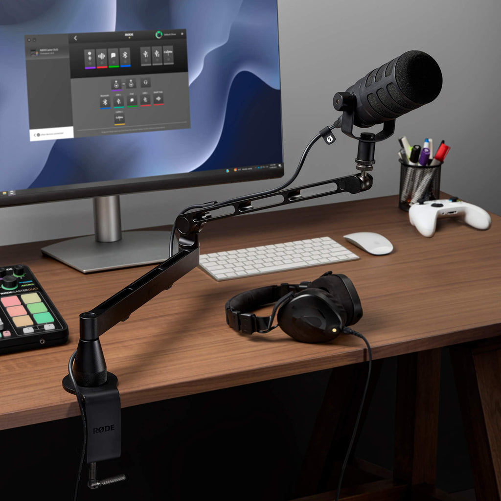 Rode LPA1 holding a broadcast microphone on a desk streaming setup